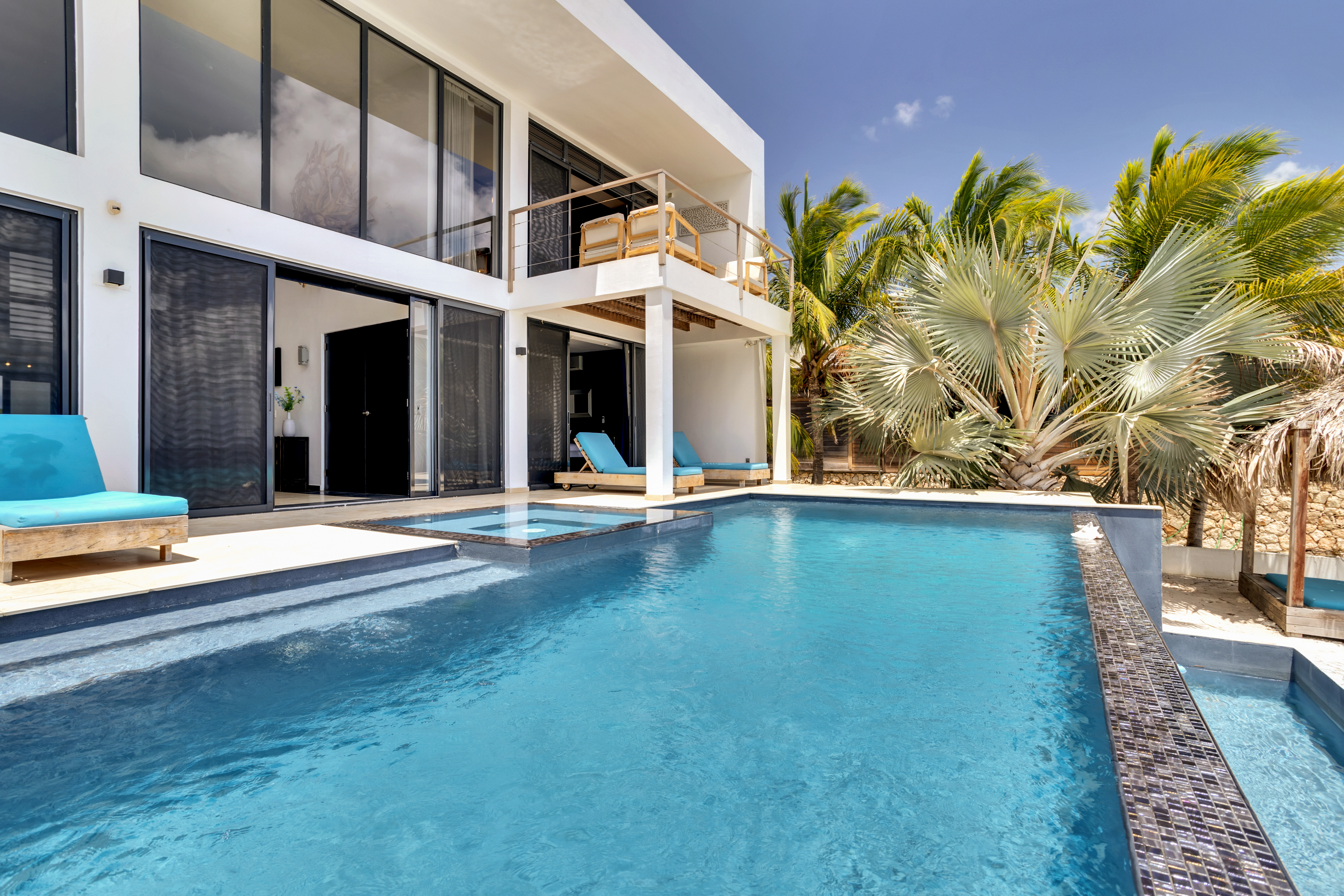 Beach Villa 1, its private pool, and palm-framed terrace
