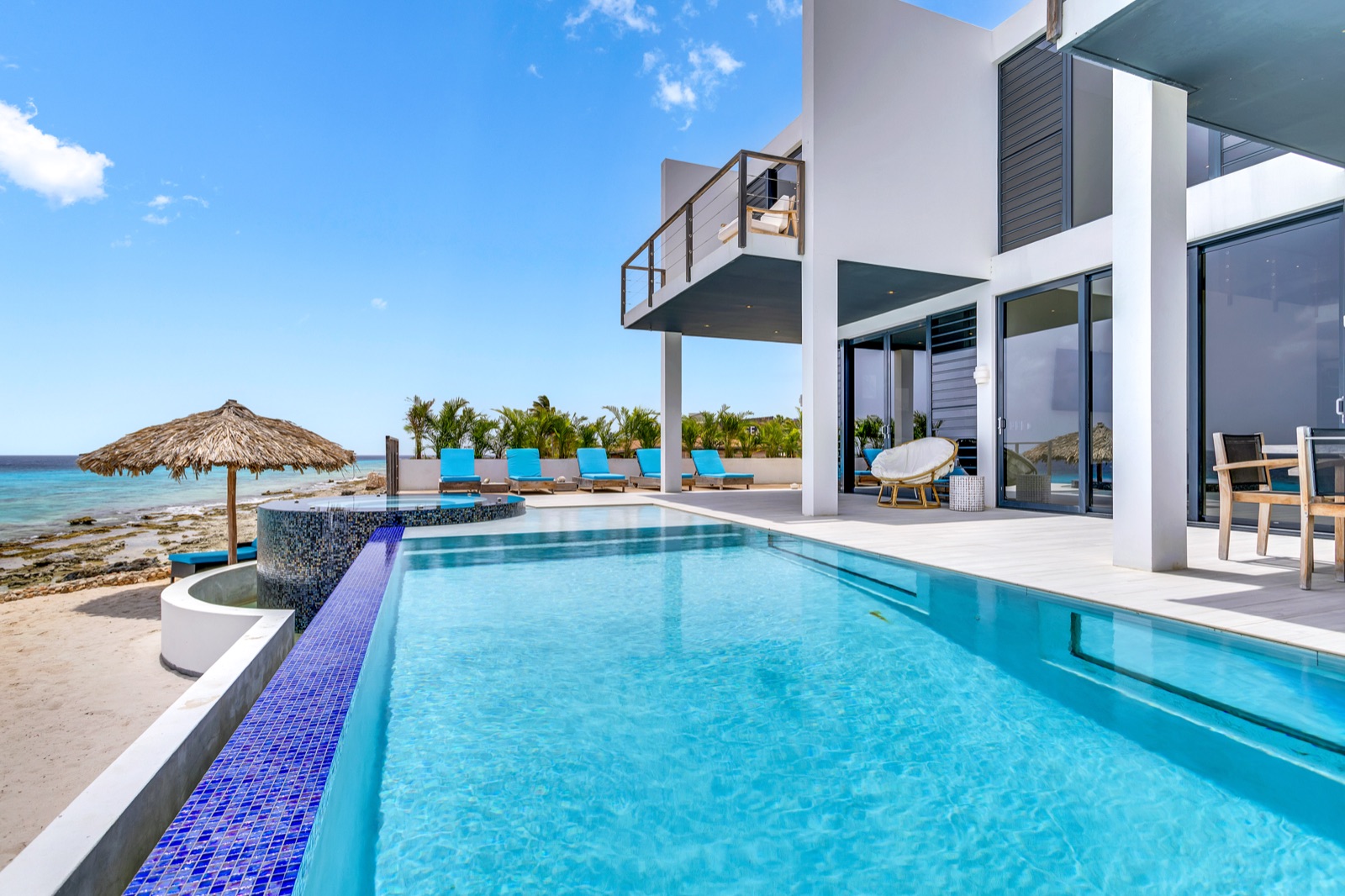 Beach Villa 3 and its curved private pool beside the sea
